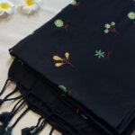 Black khadi cotton with hand-embroidered floral motifs - ZAR571